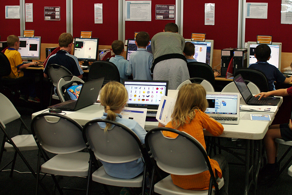 Students at a code club working on computers