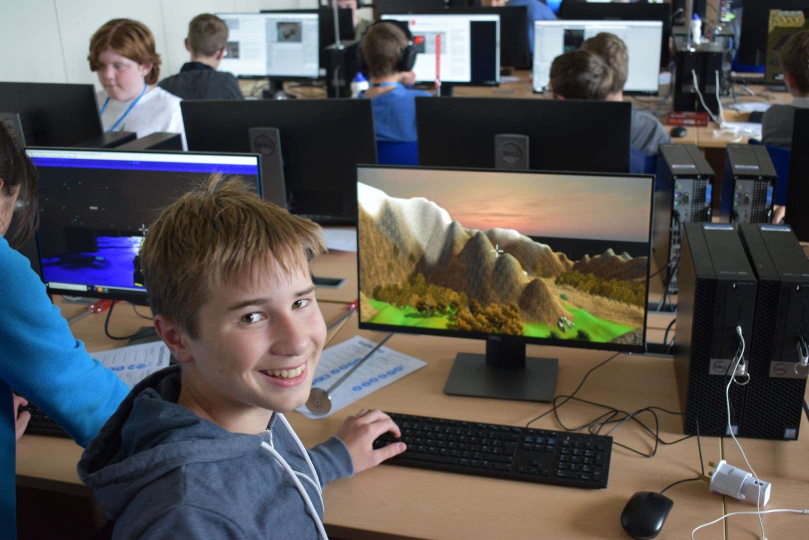 Boy with the virtual world he has designed on our Game Design course