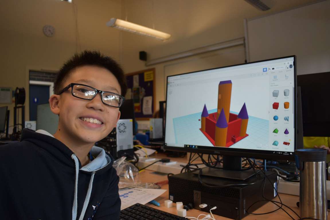 Boy showing off his 3D designs